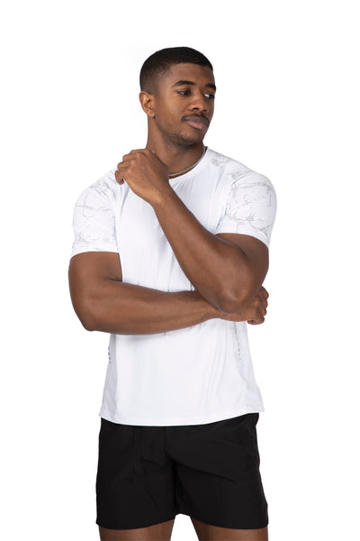 Man wearing a white athletic shirt and black shorts on a white background